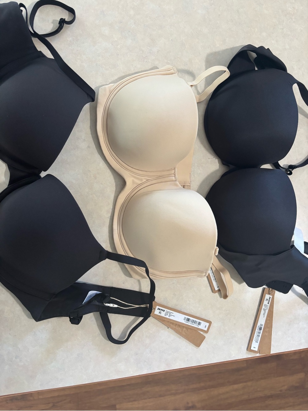 SKIMS Convertible Strapless Molded Bra in Black & Nude